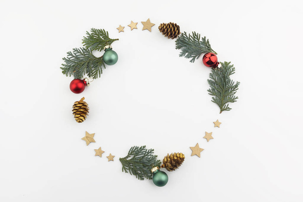 christmas or new year composition. round frame made of christmas decoration on white background. flat lay. top view - Φωτογραφία, εικόνα