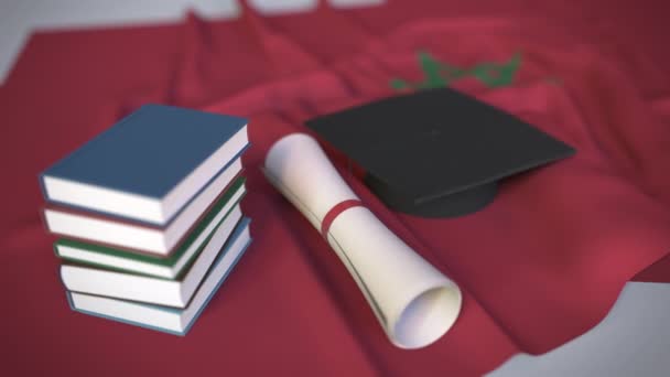 Boné de formatura, livros e diploma na bandeira marroquina. Ensino superior em Marrocos relacionado animação 3D conceitual
 - Filmagem, Vídeo