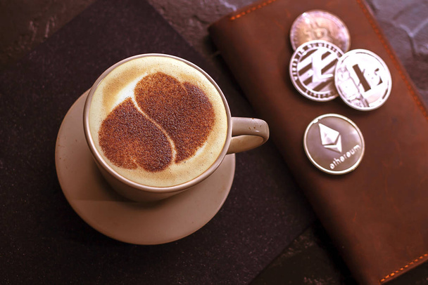 Top view of hot coffee cappuccino latte art in a ceramic glass - Фото, изображение
