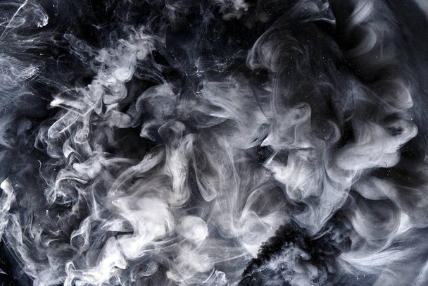 Abstract black and white swirling smoke background. Cumulus thunderclouds, mysterious and frightening sky. Paints colors of depression and negative emotions - Foto, Bild