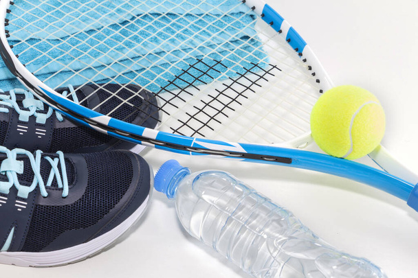 Tennis on a light background. sneakers, tennis racket, ball, - Photo, Image