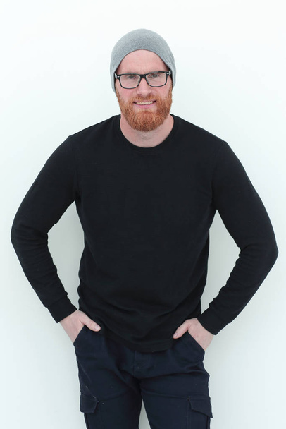 confident man in a black sweater and a wool cap - Fotografie, Obrázek