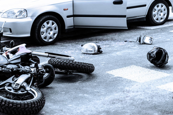 Motorcycle and car after terrible accident on the road - Foto, imagen