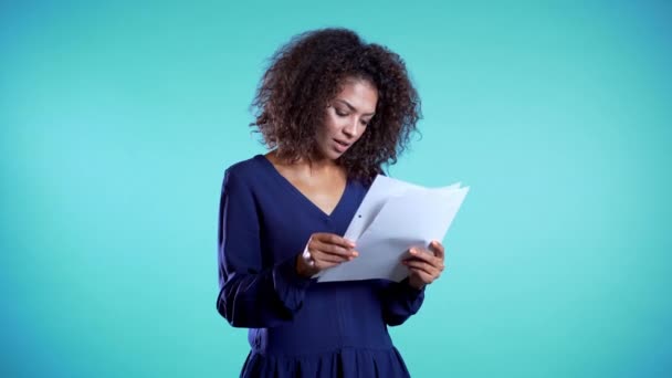 Pretty african american female boss checks documents, utility bills.  - Filmagem, Vídeo