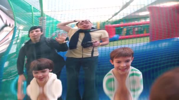 A crazy family poses and grimaces in a distorted mirror. - Footage, Video