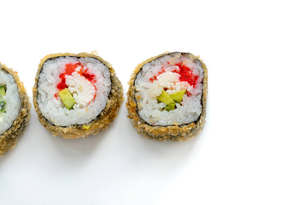 Hot Sushi Roll with salmon, eel, tuna, avocado, royal prawn, cream cheese Philadelphia, caviar tobica, chuka. White background. - Foto, Imagem