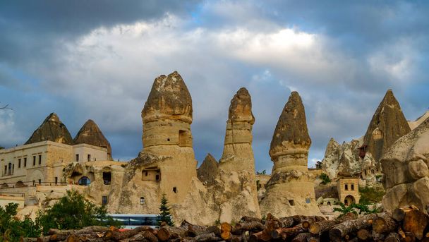 Mountain landscape in Pigeon valley in Cappadocia, Turkey. Unreal rock formations of Cappadocia - Фото, изображение