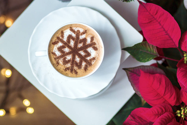 Cappuccino with snowflake latte art on milk foam, Christmas holidays - Фото, зображення