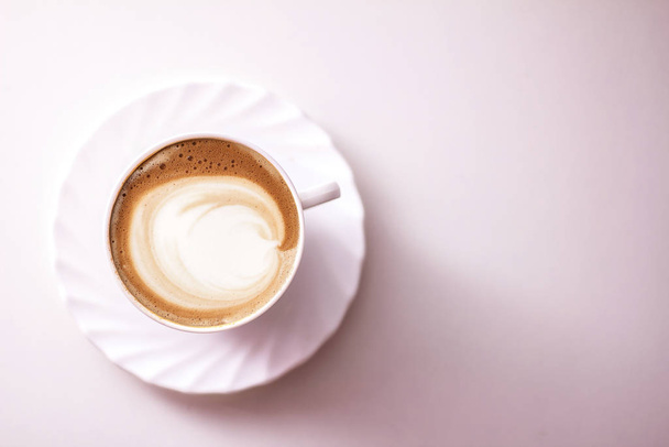 Top view of hot coffee cappuccino latte art in a ceramic glass - Φωτογραφία, εικόνα