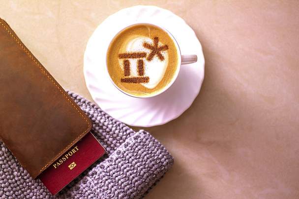 Top view of hot coffee cappuccino latte art in a ceramic glass - Fotó, kép