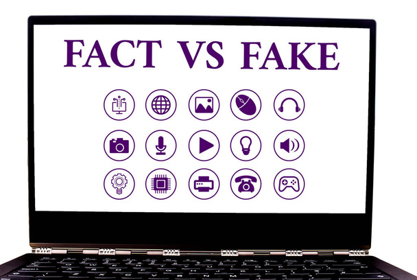 Conceptual hand writing showing Fact Vs Fake. Business photo showcasing Rivalry or products or information originaly made or imitation. - 写真・画像