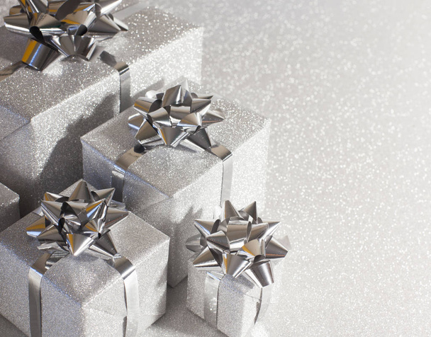Silver holiday gifts on glitter background - Φωτογραφία, εικόνα
