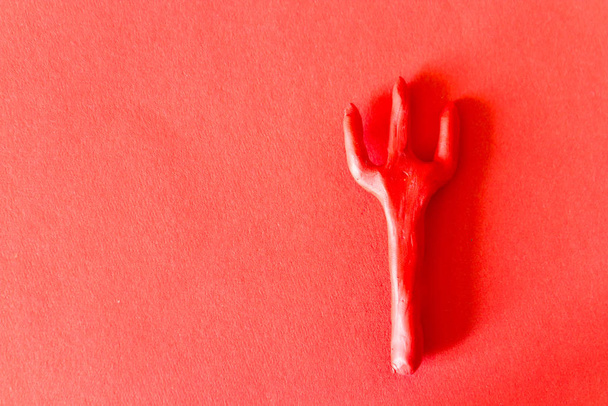 Trident on red background - Photo, Image