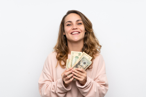 Jonge blonde vrouw neemt veel geld - Foto, afbeelding
