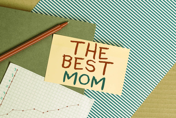 Conceptual hand writing showing The Best Mom. Business photo showcasing Appreciation for your mother love feelings compliment Striped paperboard cardboard office study supplies chart. - Photo, Image