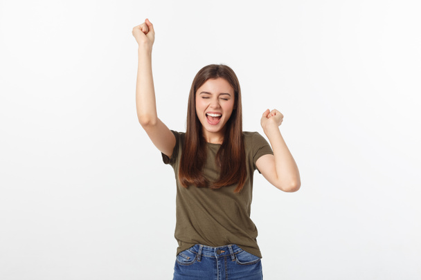 Winning success woman happy ecstatic celebrating being a winner. Dynamic energetic image of Caucasian female model isolated on white background - Photo, Image