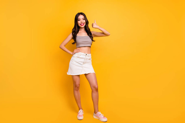 Full length body size photo of cheerful positive pretty nice cute girlfriend showing you thumb up smile toothy with hand on waist isolated bright color background - Foto, immagini