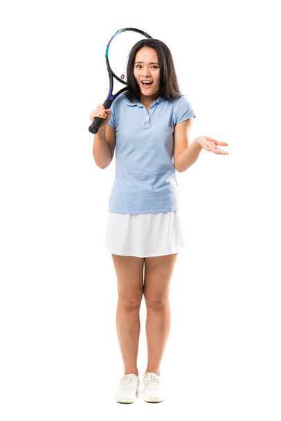 Young asian tennis player over isolated white background with shocked facial expression - Photo, Image