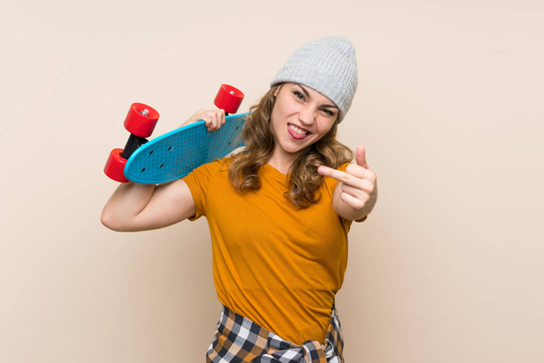 Young skater blonde girl over isolated background - Foto, immagini