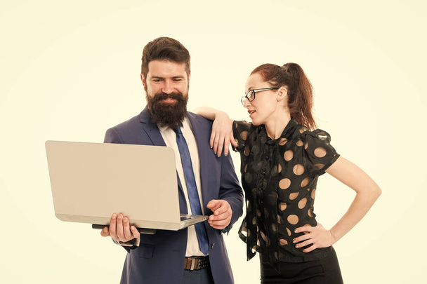happy to see good results. happy bearded man and woman with laptop. businessman with partner look with positive smile. partnership was successful. businessman and secretary work on laptop in office - Zdjęcie, obraz