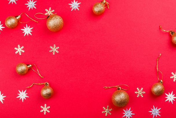 Beautiful festive red background with sparkles and Christmas golden toys. Holiday Content. - Foto, Imagem