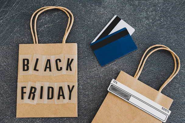 black friday shopping bag with payment cards and extra bag next  - Fotó, kép