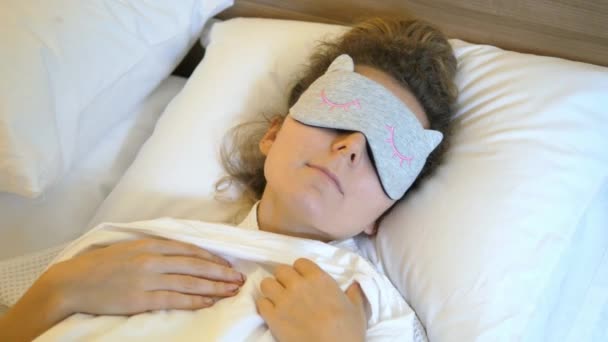 Woman In Bed In Sleeping Mask - Materiał filmowy, wideo