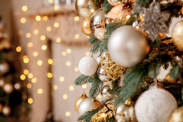 Decorated Christmas tree on blurred, sparkling and fairy background - Photo, Image