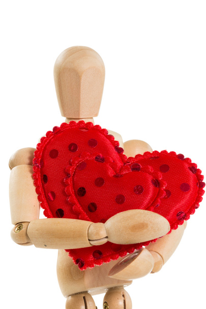 Mannequin en bois tenant coeur rouge, isolé
 - Photo, image