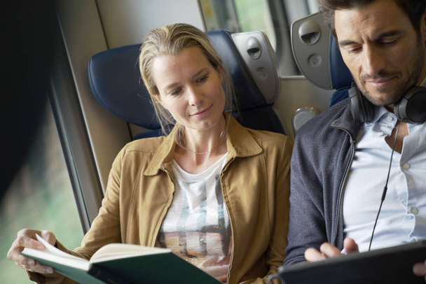 couple traveling in a train - Photo, image
