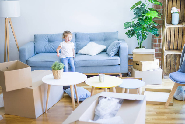 Beautiful toddler child girl jumping on the sofa - Photo, image