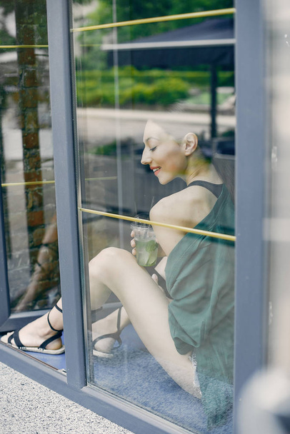 Fashion girl standing in a summer cafe - Valokuva, kuva