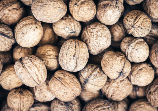 Natural walnut in shell background pattern texture. - Foto, Imagen