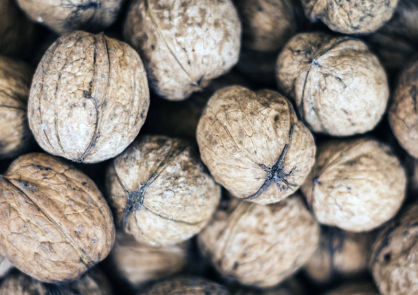 Natural walnut in shell background pattern texture. - Fotoğraf, Görsel