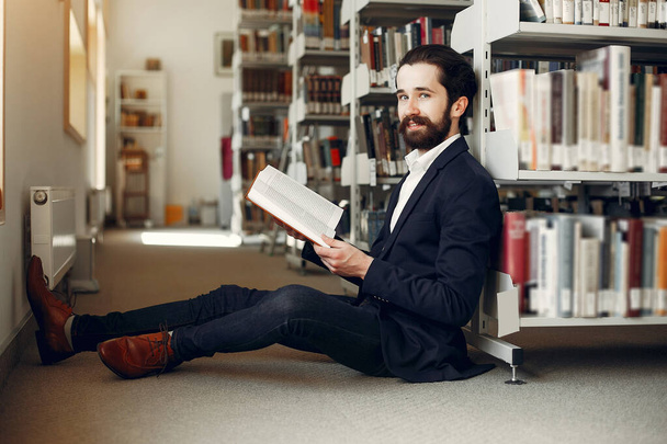 Handsome guy study at the library - 写真・画像