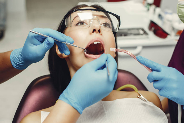 Beautiful girl in a dentist - Fotó, kép