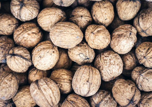 Natural walnut in shell background pattern texture. - Photo, Image