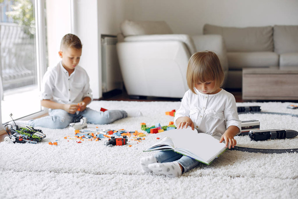 Children playing with lego in a playing room - Foto, Bild