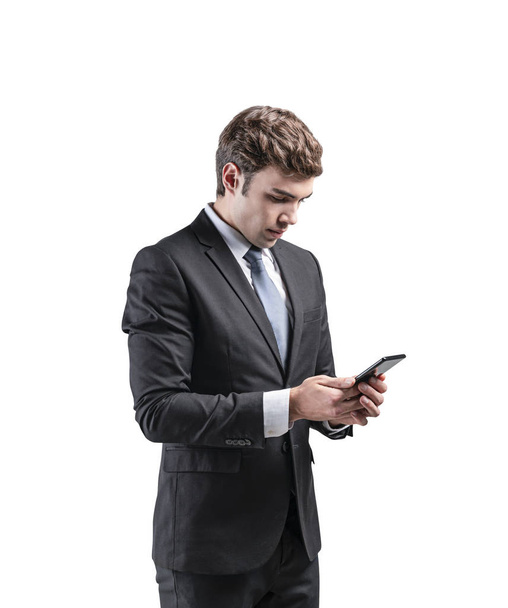 Side view of businessman looking at phone isolated - Фото, изображение