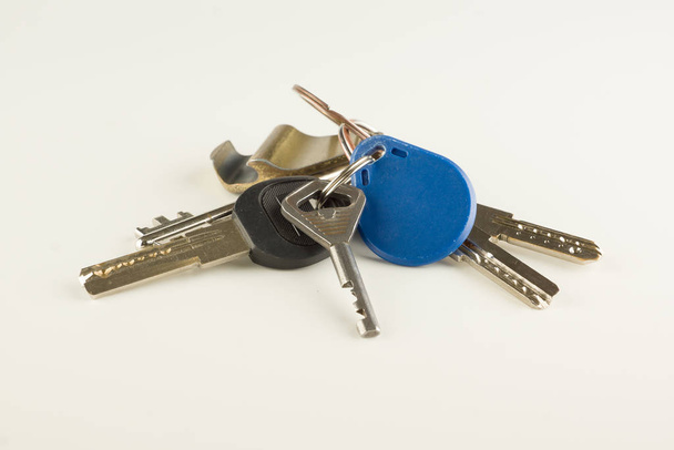 large bunch of different keys isolated - 写真・画像