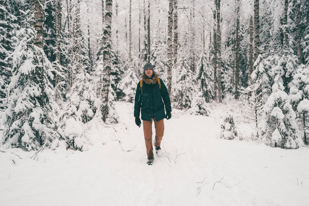 Full-length photo of tourist man in winter forest . - Foto, Imagem