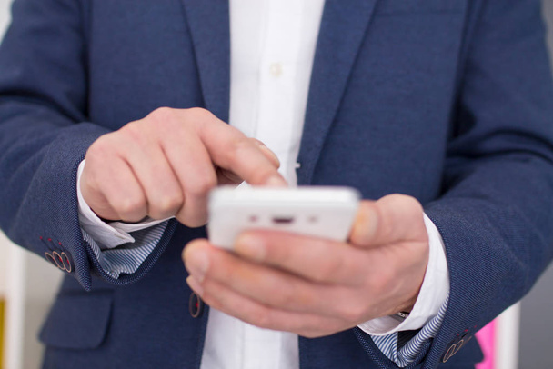 businessman using the mobile phone in the office - Photo, image
