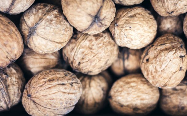 Natural walnut in shell background pattern texture. - Φωτογραφία, εικόνα