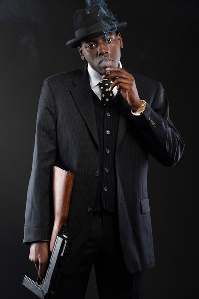 Retro african american mafia man wearing striped suit and tie an - Zdjęcie, obraz
