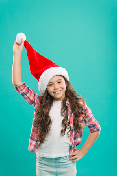 Wish to grow faster. Santa claus kid. Happy winter holidays. Small girl. Waiting for Santa. Spread joy and love, it is Christmas season. Little girl child santa hat. Present for xmas. New year party - Фото, зображення