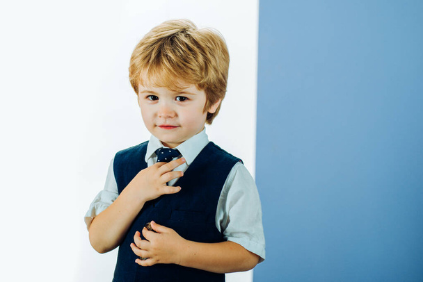 How to teach a boy to tie a tie. Etiquette lessons. Business clothes for men. Ways to tie. The boy shows his business dress code. - Photo, Image