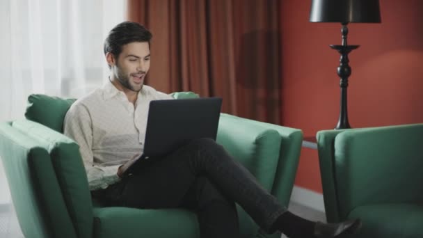 Businessman working laptop at remote workplace. Happy man getting good news - Felvétel, videó
