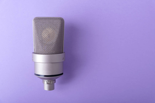 Large diaphragm condenser studio microphone. On purple background. - Valokuva, kuva