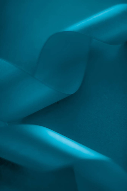 Abstract silk ribbon on aqua blue background, exclusive luxury b - Zdjęcie, obraz