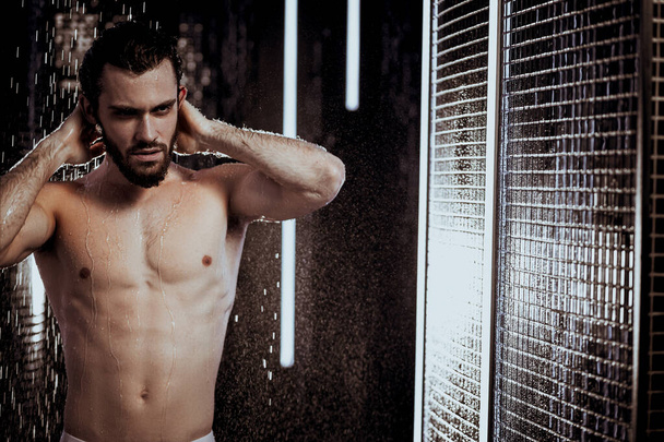 attractive young man showering - Foto, Imagen